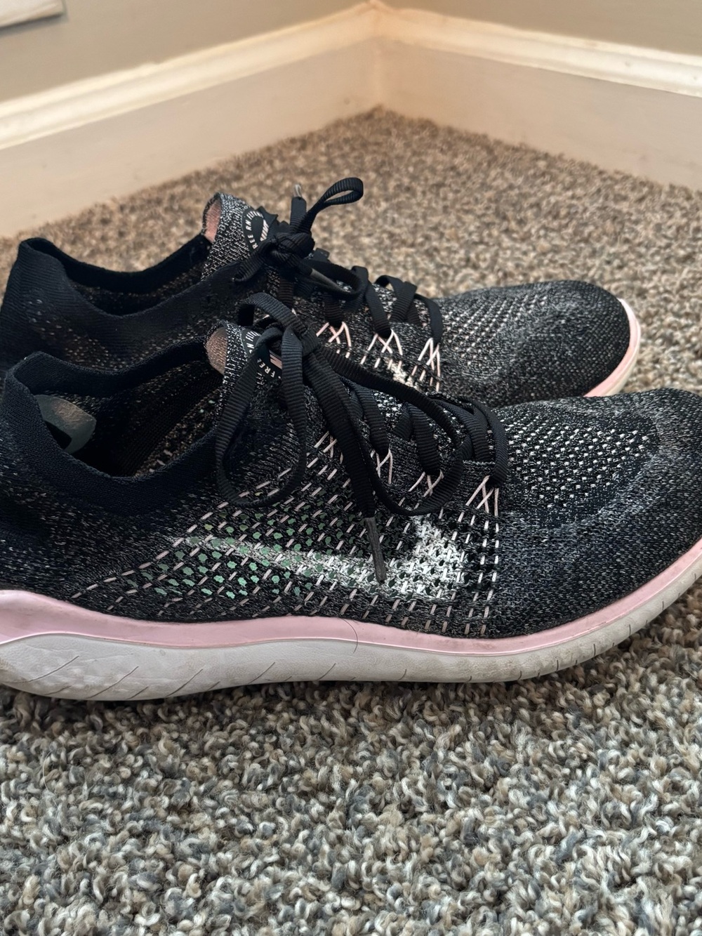 Nike Women's Black and Pink Flyknit Training Sneakers